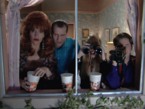 Al-Bundy-And-The-Family-Popcorn-Gif-While-They-Get-Their-Entertainment-From-The-Neightbors.gif
