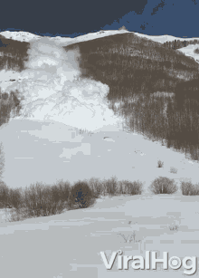 huge-avalanche-rips-down-mountain-huge-avalanche.gif