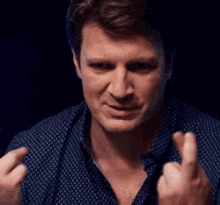 nathan-fillion-fingers-crossed.gif