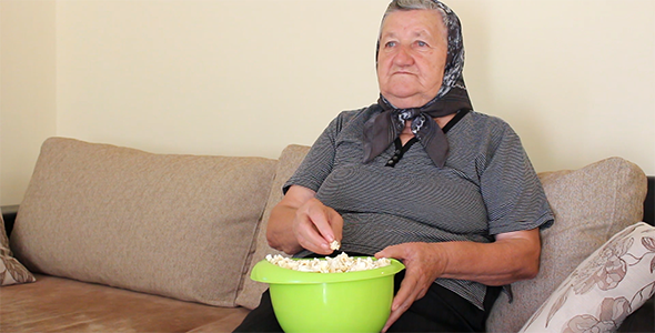 grandmother%20eating%20popcorn%20from%20the%20bowl-preview.png
