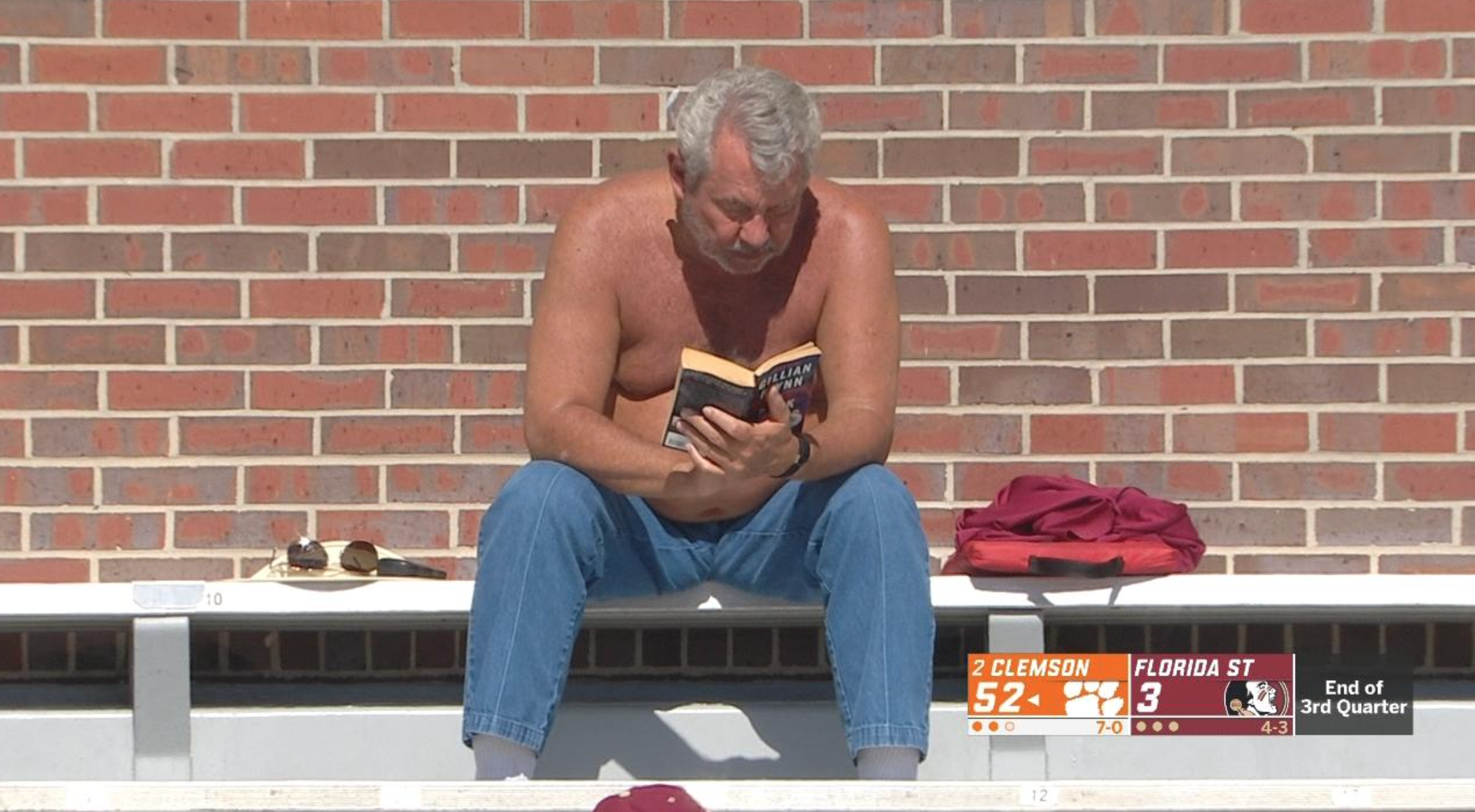 Shirtless FSU fan reading a novel is the real hero of Clemson game