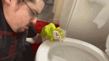 cleaning-the-toilet-bowl-ricky-berwick.gif