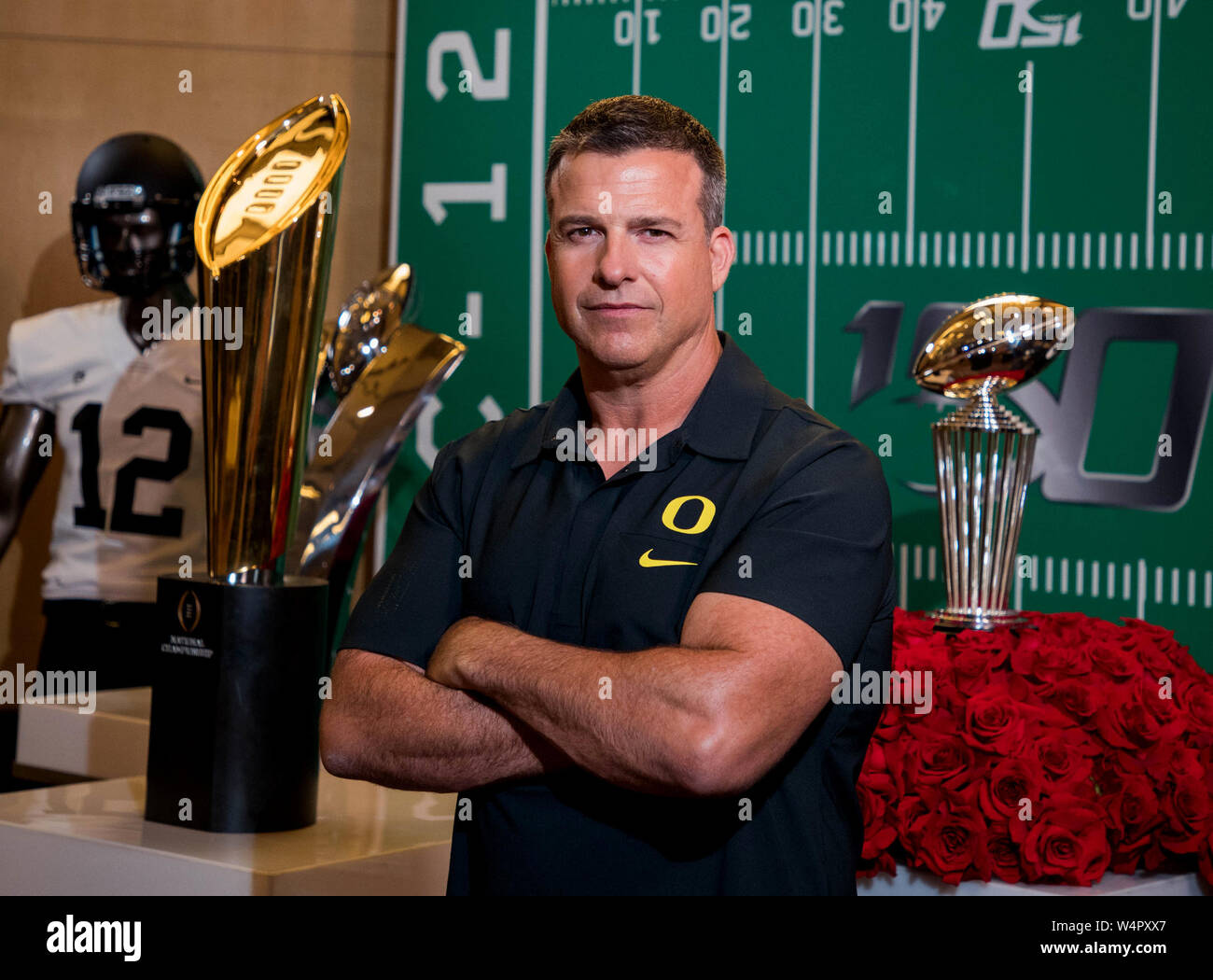 hollywood-ca-24th-july-2019-oregon-ducks-head-coach-mario-cristobal-poses-for-a-photo-in-front-of-the-rose-bowl-and-national-championship-trophies-at-the-pac-12-football-media-day-on-wednesday-july-24-2019-at-the-hollywood-and-highland-in-hollywood-ca-mandatory-credit-juan-lainezmarinmediaorgcal-sport-media-complete-photographer-and-credit-required-credit-csmalamy-live-news-W4PXX7.jpg