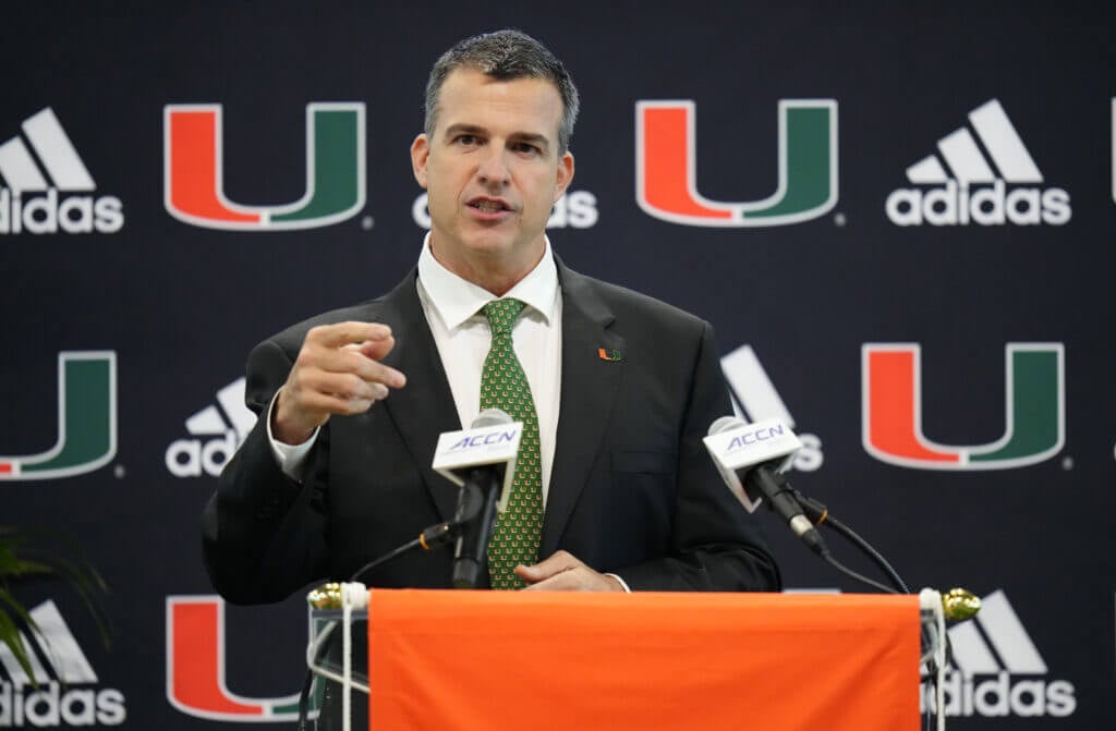 MIAMI, FLORIDA - DECEMBER 07: New Head Coach Mario Cristobal of the Miami Hurricanes speaks with the media during a press conference introducing him at the Carol Soffer Indoor Practice Facility at University of Miami on December 07, 2021 in Miami, Florida. Cristobal becomes the 26th head football coach in the programs history (Photo by Mark Brown/Getty Images)