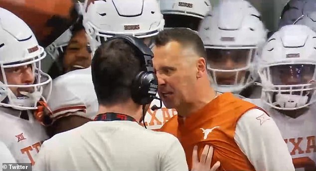 66058953-11586691-Texas_coach_Steve_Sarkisian_snapped_at_a_broadcast_aide_before_t-m-7_1672440536936.jpg