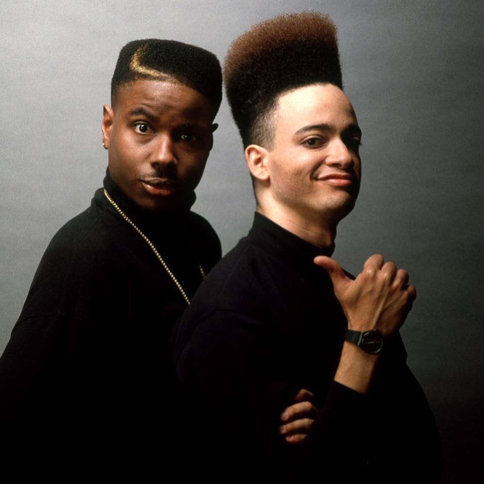 Why does a high school student in 1997 have kid n play hair? And ...